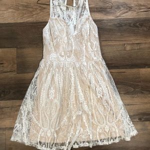 White and nude lace mini dress